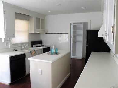 Kitchen with island and recessed lighting, leading