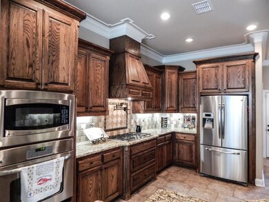 Gorgeous wood cabinetry in this Kitchen!