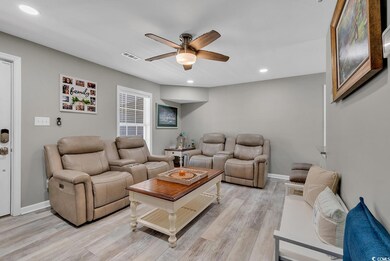 Living room featuring light hardwood / wood-style 