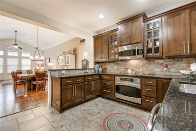 Kitchen with stainless steel appliances, a penins