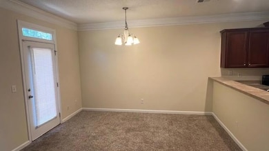 Unfurnished dining area featuring carpet flooring,