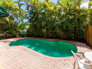 Amazing pool with a beautiful line of Palm Trees. 