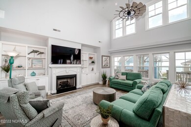 Open LR w/ fireplace & cathedral ceiling