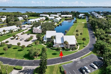 Aerial view of property and surrounding area featuring a large body of water