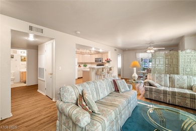 Living room featuring light wood-type flooring and