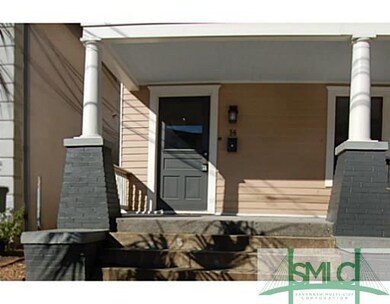 Exterior Front. Solid masonry porch foundation wit