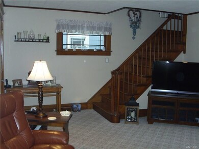 Living Room with Natural Wood Staircase