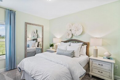 Bedroom with carpet floors and baseboards