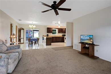 Main house living room off front door with views of dining area and kitchen