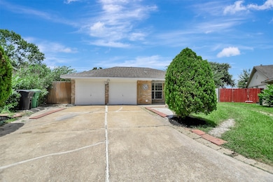 This photo shows a single-story home with a brick