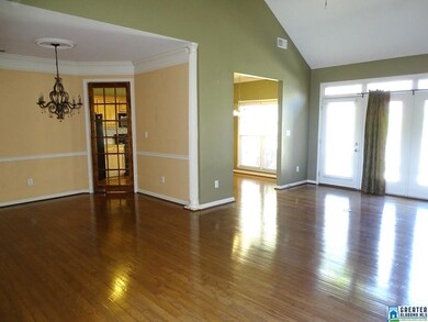 with soaring ceilings and hardwood floors