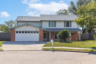 This is a two-story home with a brick and siding e
