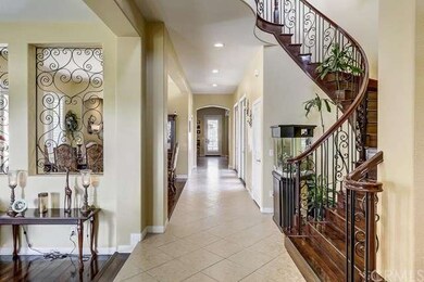 Entryway with Elegant Spiral Rod Iron Staircase