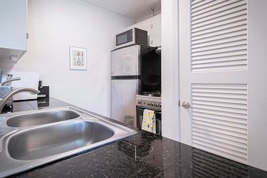 Kitchen featuring a sink, range with gas stovetop