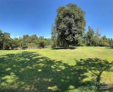 Old homesite with a perfect garden spot just beyond the fence.