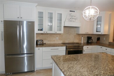 Kitchen with tasteful backsplash, stainless steel
