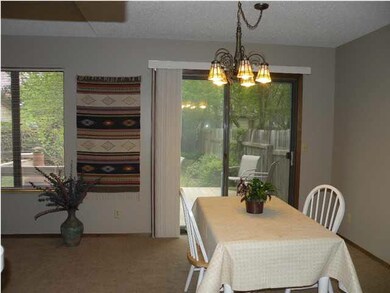 Dining area leads to deck and fenced back yard.