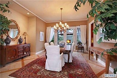 Intimate dining room with French doors leading to 