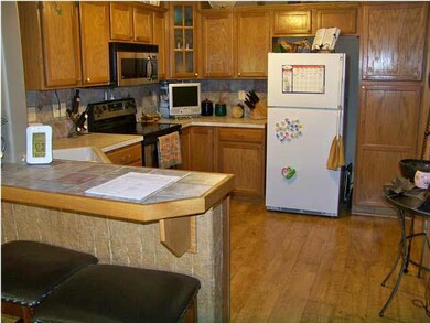 Wood floor in organized kitchen, pantry