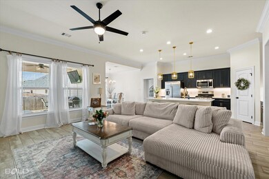 Living area featuring wood finish floors, ornament