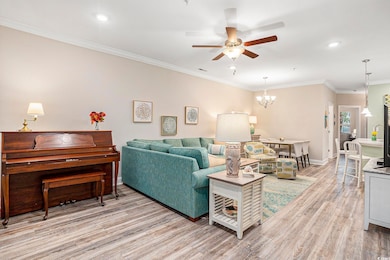 Living room with crown molding, light wood-style floors, a chandelier, recessed lighting, and ceiling fan