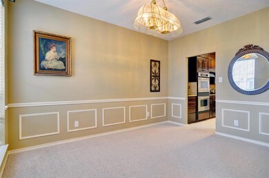 Formal dining with entry to kitchen