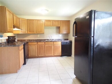 Spacious kitchen with plenty of cabinets.
