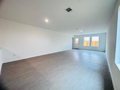 Spacious and inviting living area perfect for relaxation and entertaining.