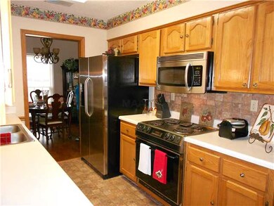 Kitchen with tile floor and backsplash, built in m