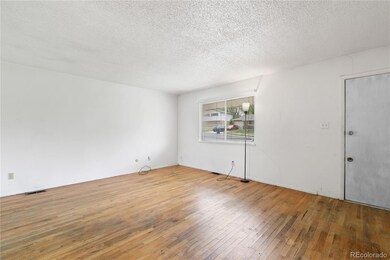 The Living Room offers hardwood floors and a windo
