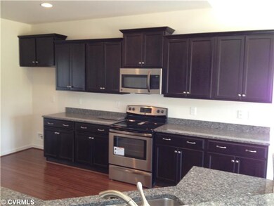Kitchen - This kitchen has it all! Stainless steel appliances, pantry, hardwood floors, granite counters & bar-top!