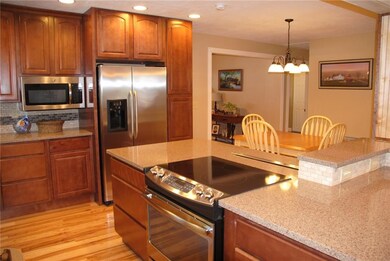 Kitchen with Maple cabinets and Quartz countertops