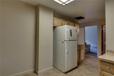 The eat-in kitchen has enough room for a small kit