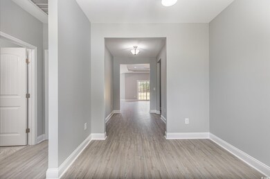 Hallway featuring light hardwood / wood-style flooring