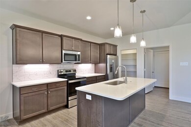 Kitchen featuring sink, light wood-type flooring, 