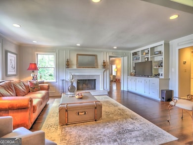 Family Room with masonry fireplace and built in bookcases