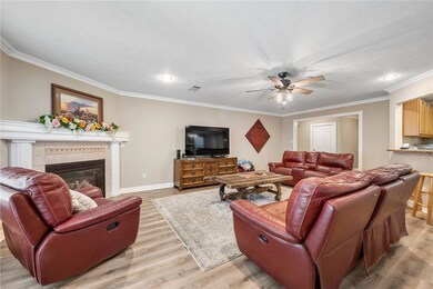 Large living area with neutral color walls and flo