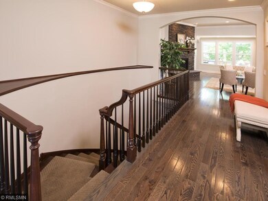 The large, welcoming foyer has a beautiful curved 