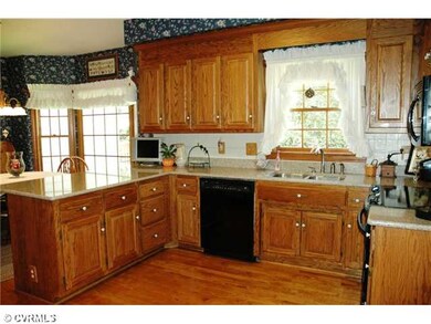 Kitchen - Kitchen with oak raised panel cabinets a