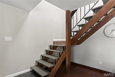 Staircase with natural light from the Skylight.