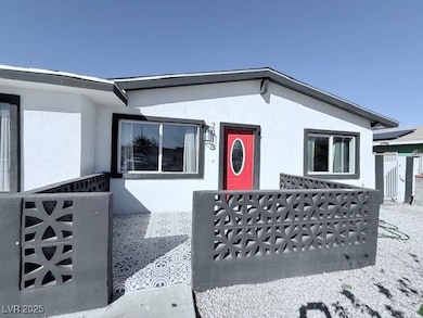 Property entrance with stucco siding