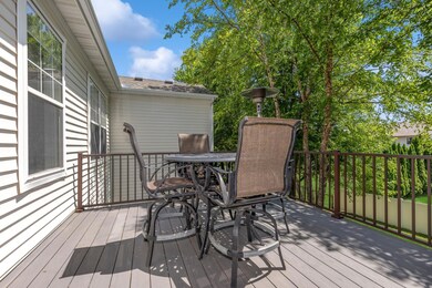 Newer, maintenance free decking and rail system located off the amazing sunroom.