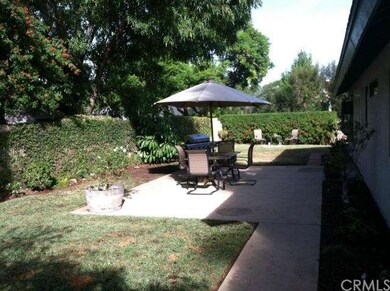 Open patio area covered by the shade from trees. F