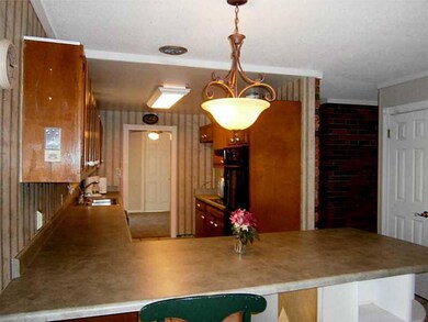 Kitchen. Plenty of cabinets for storage in this fr