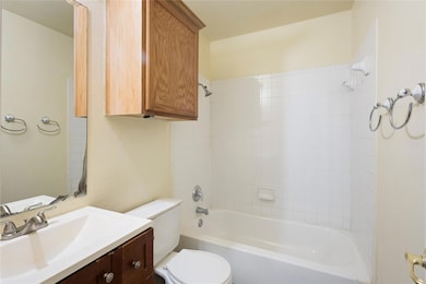 Full bath featuring vanity and bathtub / shower c