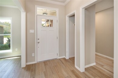 Entrance foyer featuring new front door.