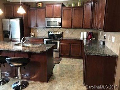 Castle-Style Cabinets, Stainless Appliances
