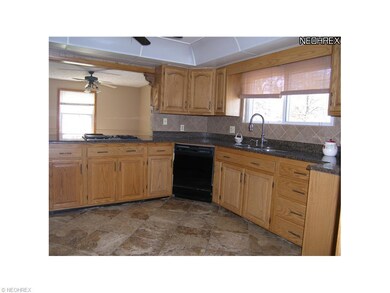 Unit 1 Kitchen view A. Beautiful tile floors and c