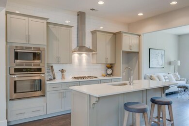 Notice the tall cabinets with crown moulding.  All the drawers throughout the home have slow-close mechanisms.