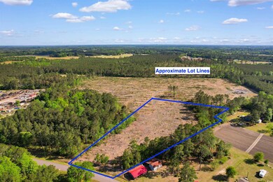 Aerial view with a rural view and a wooded view
